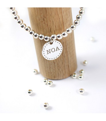Pulsera personalizada de plata con medallas y nombres grabados